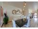 Bright dining area with modern white chairs and artful vine wall decor at 10020 W Tortalita Way, Casa Grande, AZ 85194
