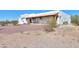 Beautiful single-story home with a covered porch, desert landscaping and mountain views at 10020 W Tortalita Way, Casa Grande, AZ 85194