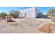 Back corner view of the home with arid land at 10020 W Tortalita Way, Casa Grande, AZ 85194