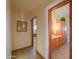 Hallway leading to bathroom and other rooms with natural wood trim at 10020 W Tortalita Way, Casa Grande, AZ 85194