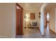 View of the hallway with beautiful flooring, a cozy chair, and stylish lighting at 10020 W Tortalita Way, Casa Grande, AZ 85194