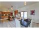 Open-concept kitchen dining area with island and ample natural light at 10020 W Tortalita Way, Casa Grande, AZ 85194
