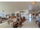Large living room with tile flooring, comfortable seating, and a dining area at 10020 W Tortalita Way, Casa Grande, AZ 85194