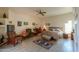 Comfortable main bedroom with a ceiling fan, wood floors, and large windows at 10020 W Tortalita Way, Casa Grande, AZ 85194