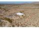 Highlighted property lines define a modern desert home, showcasing the expanse of surrounding natural landscape at 10020 W Tortalita Way, Casa Grande, AZ 85194
