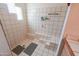 Spacious walk-in shower with tiled walls, built-in benches, and a shower mat at 10020 W Tortalita Way, Casa Grande, AZ 85194