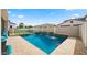 Inviting pool area with water features, lush landscaping, and ample seating at 10335 E Catalyst Ave, Mesa, AZ 85212