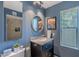 Charming bathroom with a granite vanity, round mirror and shower with tile surround at 10426 N 10Th St # 1, Phoenix, AZ 85020