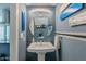 Stylish powder room with modern sink, lighting, and unique wall decorations, adding a touch of elegance at 10426 N 10Th St # 1, Phoenix, AZ 85020
