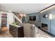 Comfortable living room showcasing a fireplace, TV, and staircase, creating a welcoming atmosphere at 10426 N 10Th St # 1, Phoenix, AZ 85020