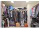 Walk-in closet with clothes racks and shelving for ample storage space at 10648 N 11Th St, Phoenix, AZ 85020