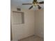 Bedroom with neutral carpet, ceiling fan, and built-in dresser at 1113 E Bisnaga St, Casa Grande, AZ 85122