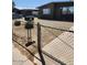 View of a well-kept yard with desert landscaping and a chain-link fence at 1113 E Bisnaga St, Casa Grande, AZ 85122