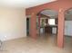 Open floor plan with archways and tile flooring leads to the kitchen at 1113 E Bisnaga St, Casa Grande, AZ 85122