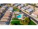 Aerial view of a community featuring a refreshing pool, a playground, and well-maintained greenery for residents at 11434 W St John Rd, Surprise, AZ 85378