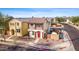 Charming two-story home featuring a front porch, balcony, and a well-maintained yard, perfect for Gathering living at 11434 W St John Rd, Surprise, AZ 85378
