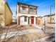 Charming two-story home with a red door, a balcony and low-maintenance landscaping at 11434 W St John Rd, Surprise, AZ 85378