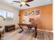 Comfortable home office with modern desk, ergonomic chair, and warm, inviting color palette for productive work at 11434 W St John Rd, Surprise, AZ 85378