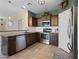 Well-equipped kitchen featuring stainless steel appliances, granite countertops, and modern cabinetry at 11434 W St John Rd, Surprise, AZ 85378