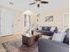 Bright living room with a staircase, cozy seating, and neutral color scheme at 11434 W St John Rd, Surprise, AZ 85378