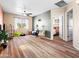 Open living room featuring natural light, a ceiling fan, and an adjacent bedroom at 11434 W St John Rd, Surprise, AZ 85378