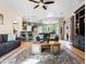 Inviting living room featuring an open floor plan, modern décor, and sliding glass door at 11434 W St John Rd, Surprise, AZ 85378