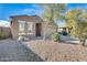 Well-maintained single-story home featuring a two-car garage and mature landscaping at 11825 W Flanagan St, Avondale, AZ 85323