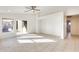 Spacious living area with tile flooring, a ceiling fan, and a view of the backyard at 11825 W Flanagan St, Avondale, AZ 85323