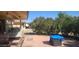 Inviting backyard patio with ample seating and lush foliage, perfect for outdoor relaxation and entertainment at 13911 W Gable Hill Dr, Sun City West, AZ 85375