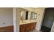 Bathroom with a double sink vanity and tiled flooring that offers functionality and convenience at 13911 W Gable Hill Dr, Sun City West, AZ 85375
