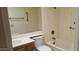 Functional bathroom featuring a vanity, toilet, and a tub/shower combo with basic fixtures for everyday use at 13911 W Gable Hill Dr, Sun City West, AZ 85375