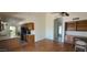 Open dining area with wood-look flooring and built-in shelves that offers versatility for entertaining at 13911 W Gable Hill Dr, Sun City West, AZ 85375
