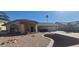 Charming single-story home with a well-maintained desert landscape and a covered porch at 13911 W Gable Hill Dr, Sun City West, AZ 85375