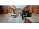 Functional kitchen with white countertops, stainless steel appliances, and wooden cabinetry that offers a convenient layout at 13911 W Gable Hill Dr, Sun City West, AZ 85375