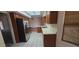 Practical kitchen showcasing stainless steel appliances, wooden cabinets, and white countertops for simple meal preparation at 13911 W Gable Hill Dr, Sun City West, AZ 85375