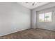 Bright bedroom with a large window and neutral carpet flooring, creating a comfortable ambiance at 15357 W Post Cir, Surprise, AZ 85374