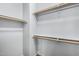 Empty white closet with shelving providing ample storage space and organization, ready for personal customization at 15357 W Post Cir, Surprise, AZ 85374