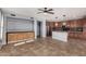 Spacious kitchen with stainless appliances, center island, and adjacent living area at 15357 W Post Cir, Surprise, AZ 85374