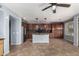 Open kitchen with stainless appliances, center island, and tile flooring at 15357 W Post Cir, Surprise, AZ 85374