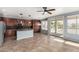 Well-lit kitchen with stainless appliances, island, and sliding glass doors at 15357 W Post Cir, Surprise, AZ 85374