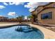Backyard pool with palm trees beside a home with a tile roof at 15357 W Post Cir, Surprise, AZ 85374