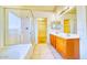 Bright bathroom with a double sink vanity, tile floors, and glass enclosed shower at 1612 E South Mountain Ave, Phoenix, AZ 85042