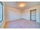 Bedroom featuring neutral walls, carpeting, a closet, and a window for light at 1612 E South Mountain Ave, Phoenix, AZ 85042