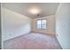 Bright bedroom featuring neutral walls, carpeting, and a window with a view at 1612 E South Mountain Ave, Phoenix, AZ 85042