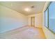 Bright bedroom featuring a window and closet with sliding doors, offering ample space and natural light at 1612 E South Mountain Ave, Phoenix, AZ 85042