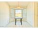 Cozy dining nook featuring a pendant light, ample natural light, and tile flooring throughout at 1612 E South Mountain Ave, Phoenix, AZ 85042