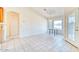 Bright dining space featuring tile floors, a window with a view, and easy kitchen access at 1612 E South Mountain Ave, Phoenix, AZ 85042