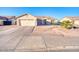 Charming single-story home featuring a two-car garage, desert landscaping, and a quaint front entrance at 1612 E South Mountain Ave, Phoenix, AZ 85042