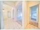 Bright, open hallway with carpet and tile flooring, and arched entryways create an inviting atmosphere at 1612 E South Mountain Ave, Phoenix, AZ 85042