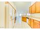Efficient kitchen layout with white appliances and tile flooring, offering a functional workspace at 1612 E South Mountain Ave, Phoenix, AZ 85042